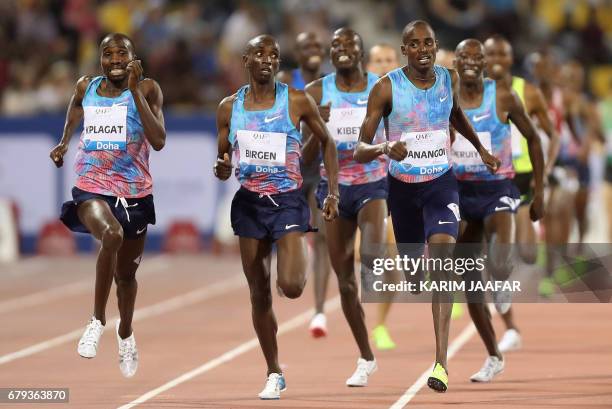 Athletes compete in the men's 1500 metres during the Diamond League athletics competition at the Suhaim bin Hamad Stadium in Doha, on May 5, 2017. /...