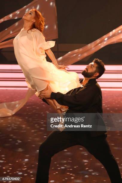 Faisal Kawusi and Oana Nechiti perform on stage during the 7th show of the tenth season of the television competition 'Let's Dance' on May 5, 2017 in...