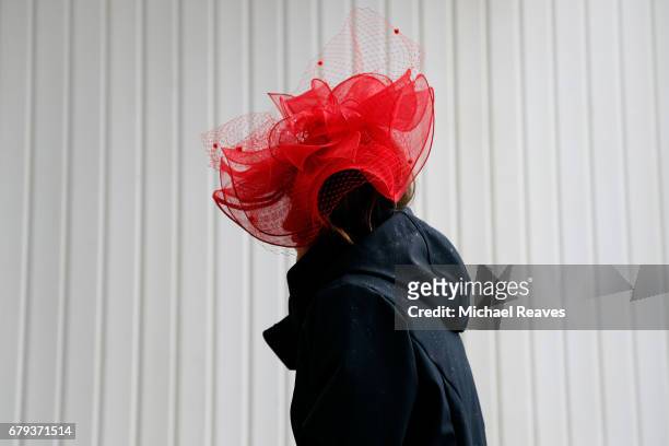 Woman wearing a festive hat looks on prior to the 143rd running of the Kentucky Oaks at Churchill Downs on May 5, 2017 in Louisville, Kentucky.