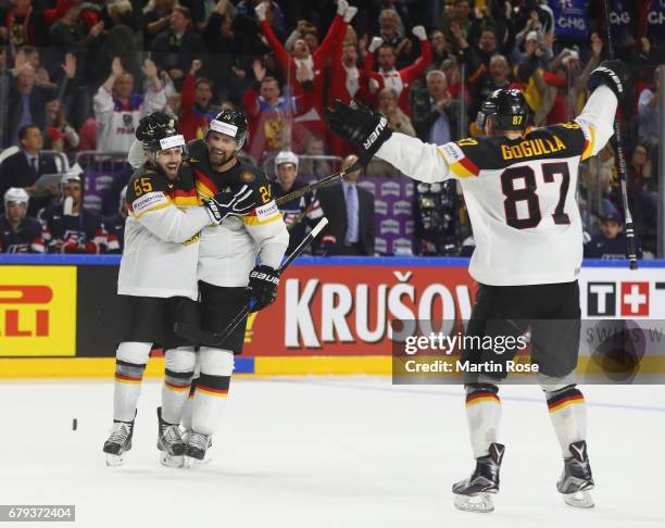 Dennis Seidenberg and Felix Schultz of Germany celebrate the second goal during the 2017 IIHF Ice Hockey World Championship game between USA and...