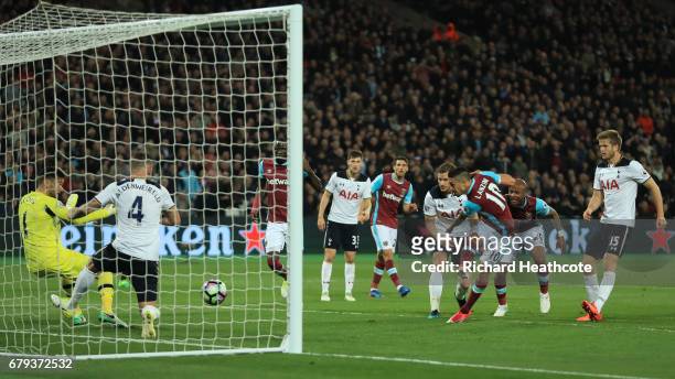 Manuel Lanzini of West Ham United scores the opening goal uring the Premier League match between West Ham United and Tottenham Hotspur at the London...