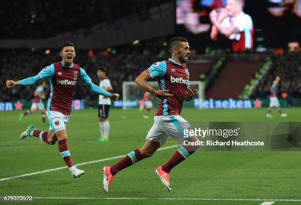 Manuel Lanzini of West Ham United celebrates after scoring the opening goal during the Premier League match between West Ham United and Tottenham...