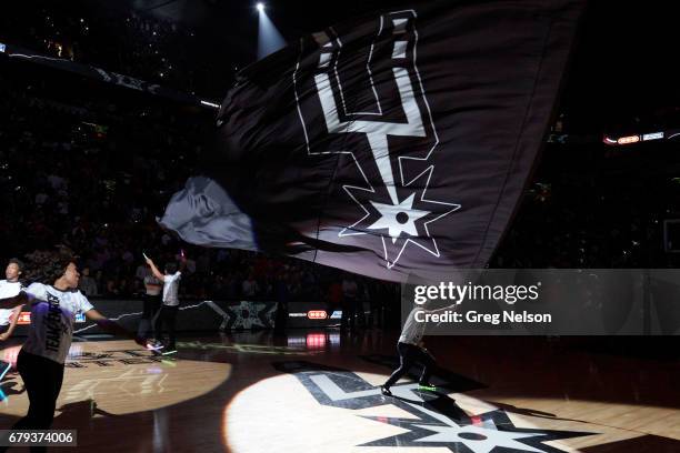 Playoffs: View of Spurs logo flag being waved by cheerleader on court before San Antonio Spurs vs Houston Rockets game at AT&T Center. Game 2. San...