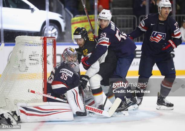 Yasin Ehliz of Germany is challenged by Jimmy Howard and Noah Hanifin of USA during the 2017 IIHF Ice Hockey World Championship game between USA and...