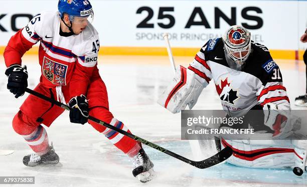 Czech Republic's defender Radim Simek challenges Canada's goalkeeper Calvi Pickard during the IIHF Men's World Championship group B ice hockey match...