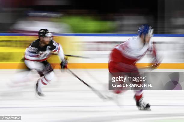 Czech Republic's forward Jan Kovar challenges Canada's forward Claude Giroux during the IIHF Men's World Championship group B ice hockey match...