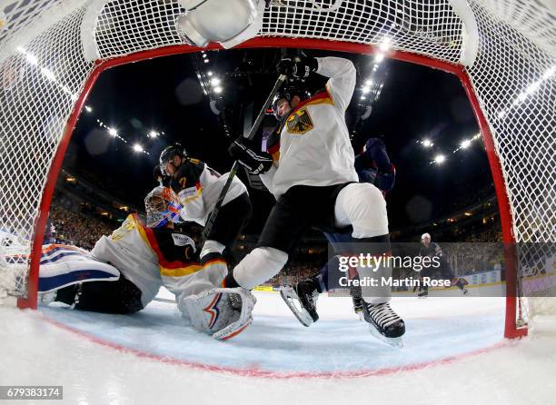 Thomas Greiss, goaltender of Germany makes a save during the 2017 IIHF Ice Hockey World Championship game between USA and Germany at Lanxess Arena on...