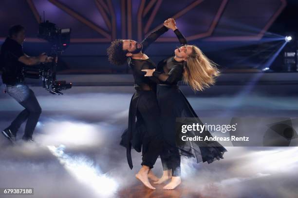 Angelina Kirsch and Massimo Sinato perform on stage during the 7th show of the tenth season of the television competition 'Let's Dance' on May 5,...