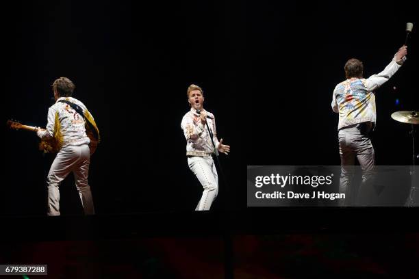 Mark Owen, Gary Barlow and Howard Donald of Take That perform on the opening night of Wonderland Live 2017 at Genting Arena on May 5, 2017 in...