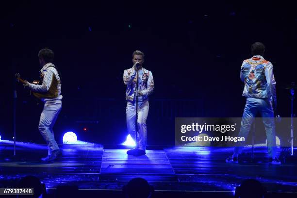 Mark Owen, Gary Barlow and Howard Donald of Take That perform on the opening night of Wonderland Live 2017 at Genting Arena on May 5, 2017 in...