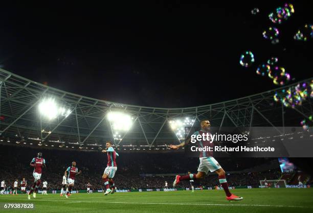 Manuel Lanzini of West Ham United celebrates scoring the opening goal during the Premier League match between West Ham United and Tottenham Hotspur...