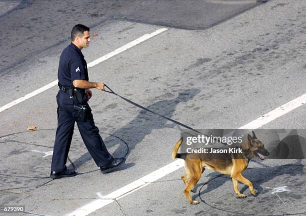 Police canine patrol walks outside the Shubert Theatre November 4, 2001 in Los Angeles, CA. The 53rd Annual Primetime Emmy Awards will take place...