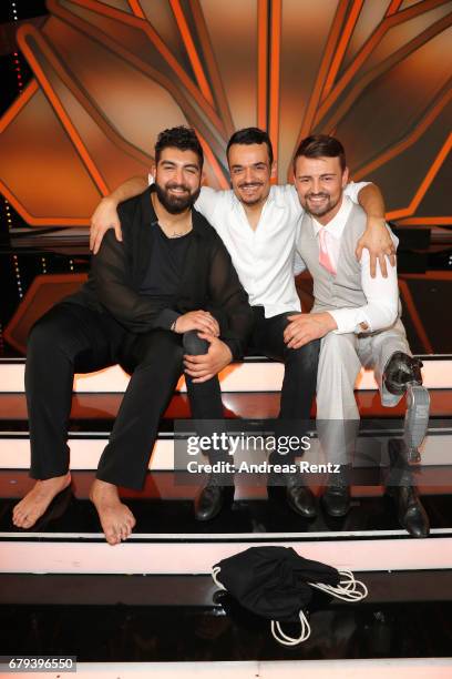 Faisal Kawusi, Giovanni Zarrella and Heinrich Popow pose on stage during the 7th show of the tenth season of the television competition 'Let's Dance'...