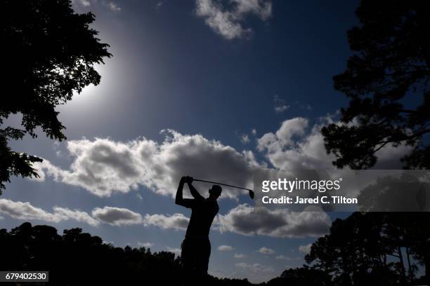 Shawn Stefani plays his shot from the 12th tee during round two of the Wells Fargo Championship at Eagle Point Golf Club on May 5, 2017 in...