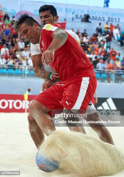 Dejan Stankovic of Switzerland is closed down by Hassan Abdollahi of Iran during the FIFA Beach Soccer World Cup Bahamas 2017 quarter final match...