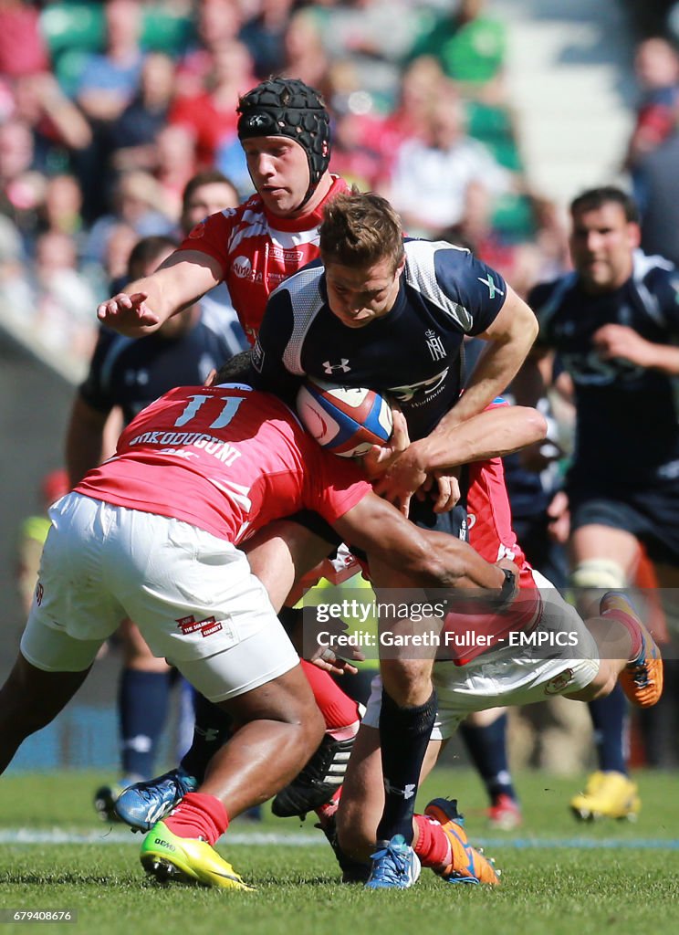 Huntley Rugby The Navy's Nathan Huntley is brought down by the Army's Semesa... News ...