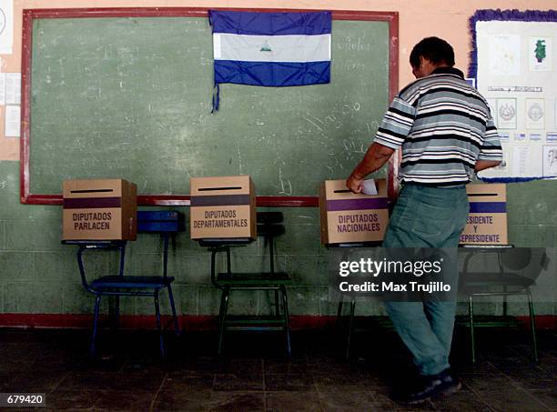 Voter casts her ballot at a polling station November 4, 2001 in Managua, Nicaragua. Nicaraguan citizens elected a new president in the country's most...