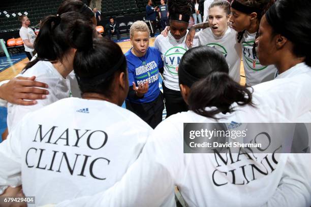 The Minnesota Lynx huddle around assistant coach Shelley Patterson of the Minnesota Lynx before the game against the Atlanta Dream during the...