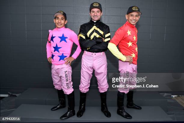 Jockeys Paco Lopez, Kent DeSormeaux, and Mike Smith pose prior to the 143rd running of The Kentucky Oaks at Churchill Downs on May 5, 2017 in...