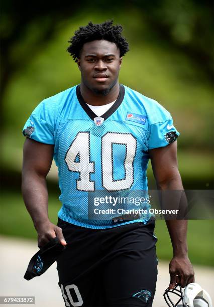 Carolina Panthers rookie fullback Alex Armah walks to the second session of the team's rookie minicamp in Charlotte, N.C., on Friday, May 5, 2017.