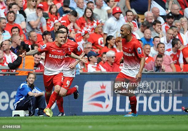 Leyton Orient's Dean Cox celebrates scoring his teams second goal of the game with teammates Romain Vincelot and Elliot Omozusi