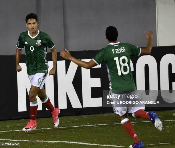 Mexico's footballer Daniel Lopez celebrates with teammate Victor Reyes after scoring against Costa Rica during their Under 17 Concacaf qualifying...