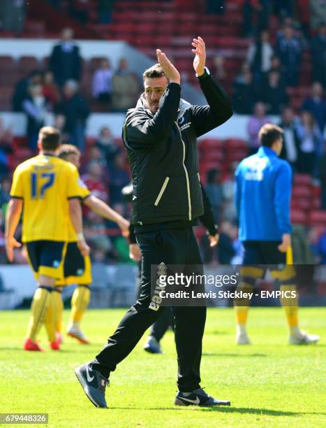Brighton & Hove Albion manager Oscar Garcia applauds the travelling fans as he celebrates making the play-offs after victory over Nottingham Forest