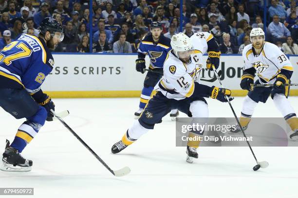 Mike Fisher of the Nashville Predators controls the puck against the St. Louis Blues in Game Five of the Western Conference Second Round during the...