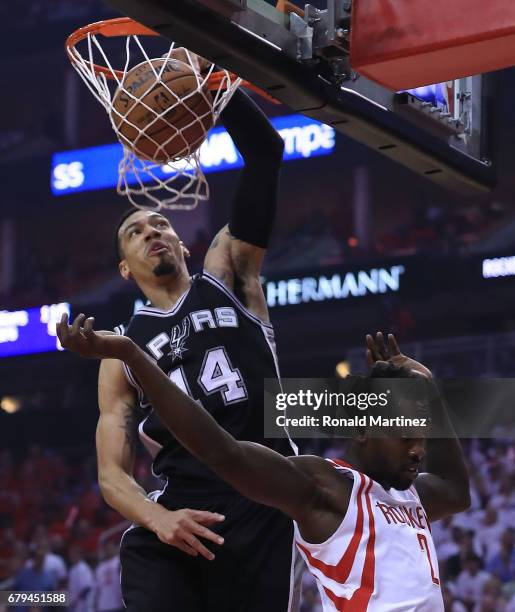 Danny Green of the San Antonio Spurs dunks against Patrick Beverley of the Houston Rockets during Game Three of the NBA Western Conference...