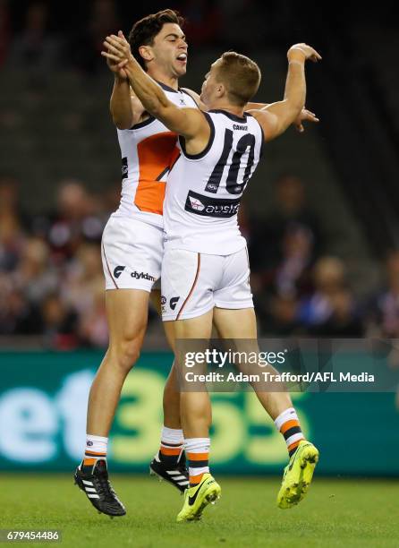 Tim Taranto of the Giants celebrates his first AFL goal with Devon Smith of the Giants during the 2017 AFL round 07 match between the St Kilda Saints...