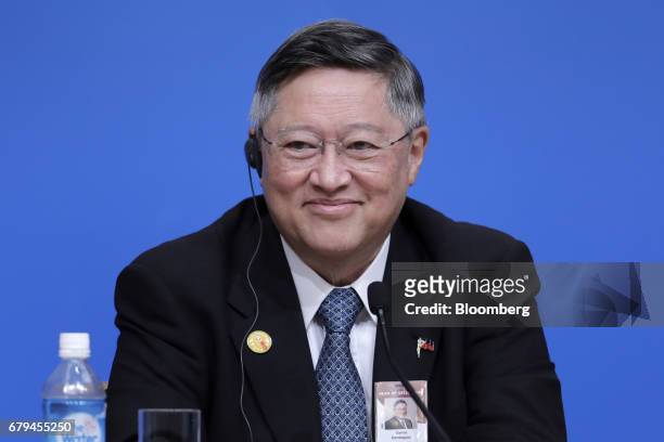 Carlos Dominguez, the Philippines' secretary of finance, reacts during a news conference following the 20th ASEAN+3 Finance Ministers and Central...