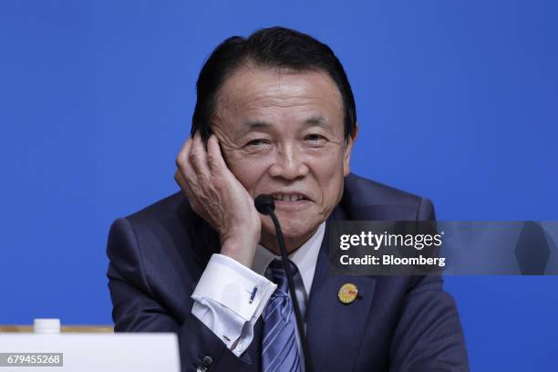 Taro Aso, Japan's deputy prime minister and finance minister, reacts during a news conference following the 20th ASEAN+3 Finance Ministers and...