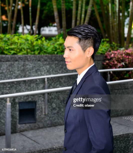 businessman in hong kong finance district - lypsehk2014 stock pictures, royalty-free photos & images