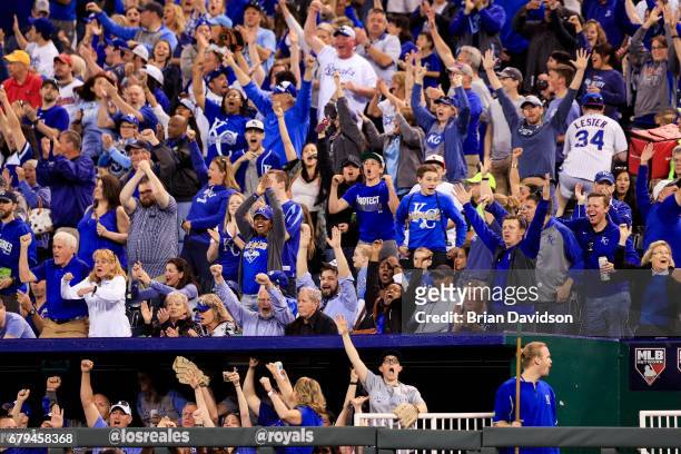 Fans react as Eric Hosmer of the Kansas City Royals hits a two run home run against the Cleveland Indians during the fifth inning at Kauffman Stadium...
