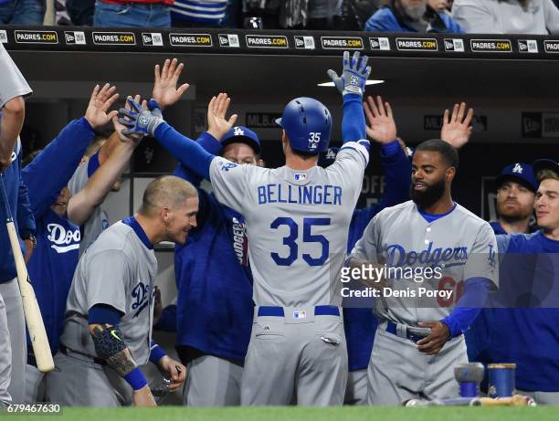 Cody Bellinger of the Los Angeles Dodgers is congratulated after hitting a solo home run during the fourth inning of a baseball game against the San...