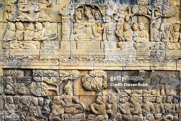 borobudur temple stone sculpture, java, indonesia - altorrelieve fotografías e imágenes de stock