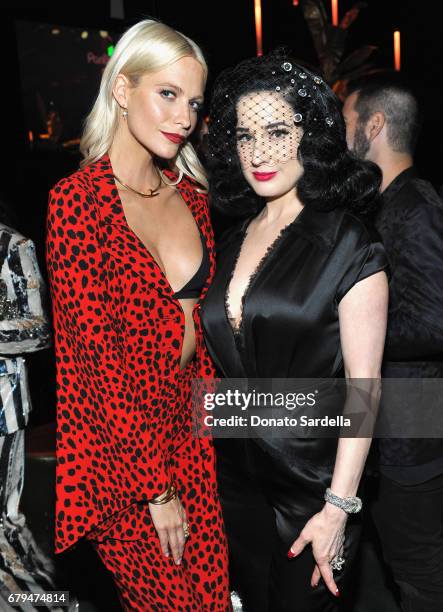 Models Poppy Delevingne and Dita Von Teese attend the Panthere de Cartier Party in LA at Milk Studios on May 5, 2017 in Los Angeles, California.