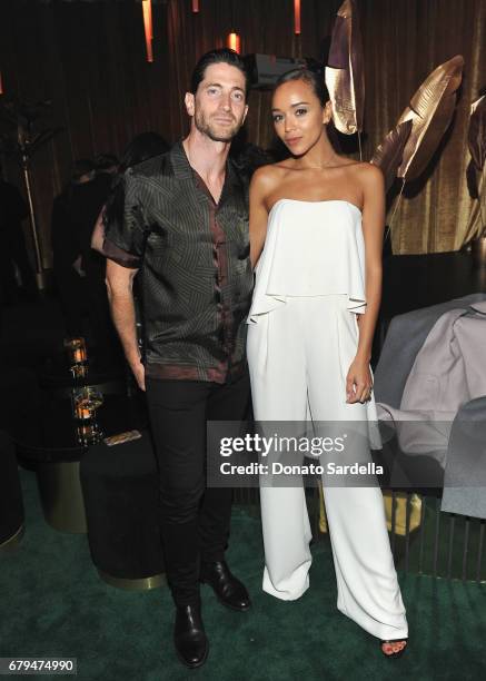 Actors Iddo Goldberg and Ashley Madekwe attend the Panthere de Cartier Party in LA at Milk Studios on May 5, 2017 in Los Angeles, California.