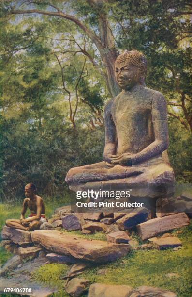 Ceylon. Seated as if wrapped in meditation this colossal stone figure of Buddha is a relic of the past glory of Anuradhapura', c1920. Anuradhapura is...