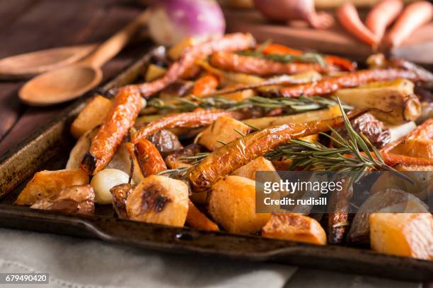 roasted root vegetables - baking tray stock pictures, royalty-free photos & images