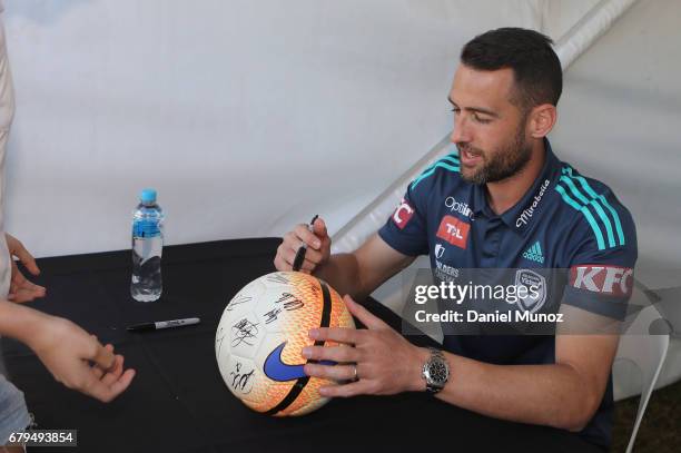Captain Carl Valeri signs autographs during a Melbourne Victory A-League media opportunity at The Entertainment Quarter on May 6, 2017 in Sydney,...