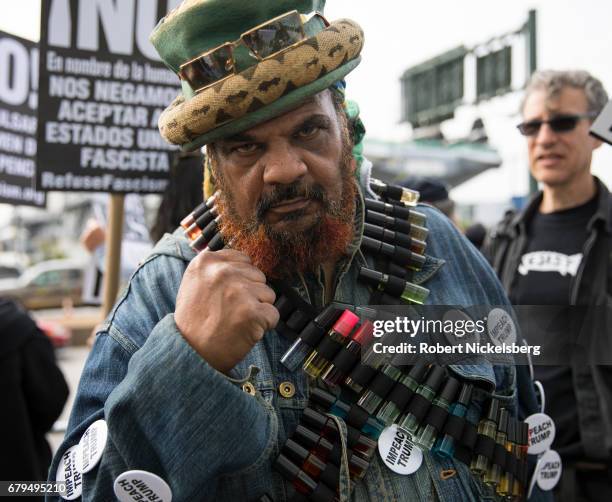 Protesters gather before the arrival of the motorcade carrying President Donald Trump near the USS Intrepid where the President is scheduled to host...