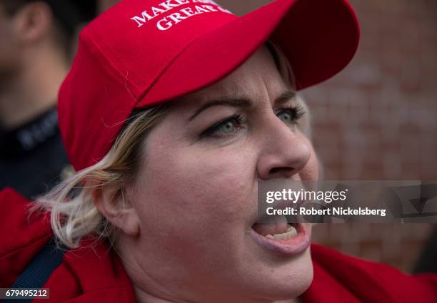 Supporter of President Donald Trump, Diane Atkins from Brooklyn, New York, speaks with media before the arrival of the motorcade carrying President...