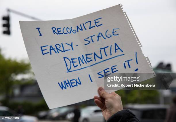 Protesters demonstrate during the arrival of the motorcade carrying President Donald Trump near the USS Intrepid where the President is scheduled to...