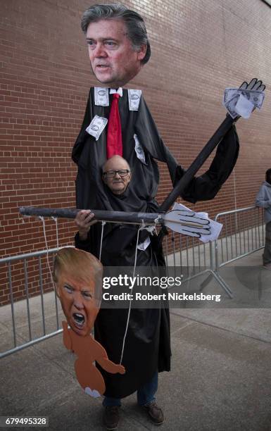 Protesters demonstrate before the arrival of the motorcade carrying President Donald Trump near the USS Intrepid where the President is scheduled to...