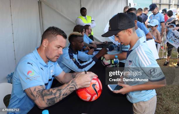 Goalkeeper Danny Vukovic signs autographs during a Sydney FC A-League media opportunity at The Entertainment Quarter on May 6, 2017 in Sydney,...