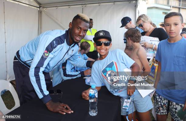 Bernie Ibini poses for a picture with fans during a Sydney FC A-League media opportunity at The Entertainment Quarter on May 6, 2017 in Sydney,...