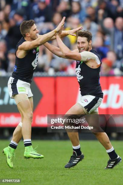 Dale Thomas of the Blues celebrates a goal with Marc Murphy during the round seven AFL match between the Collingwood Magpies and the Carlton Blues at...