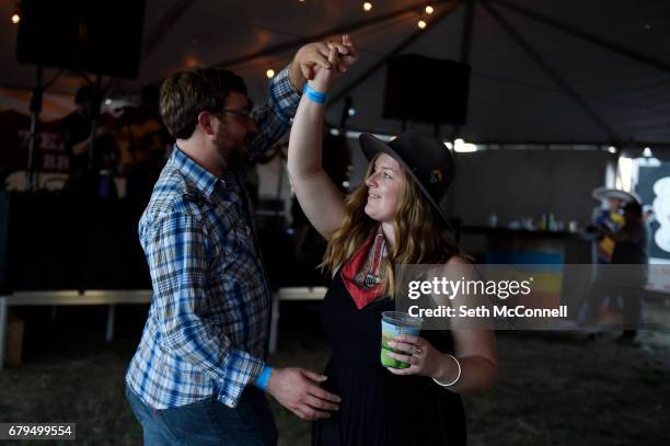 Justin Wipf and Brittany Schulenberg dance as That Damn Sasquatch performs during the Big Wonderful at the former Denver Post Printing Plant on May 5...