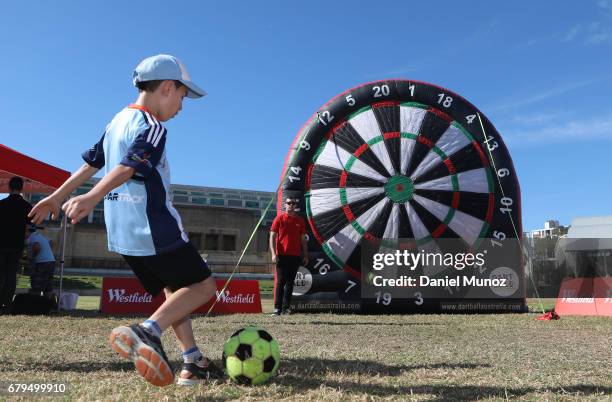 Boy plays ball dart during a Sydney FC A-League media opportunity at The Entertainment Quarter on May 6, 2017 in Sydney, Australia.